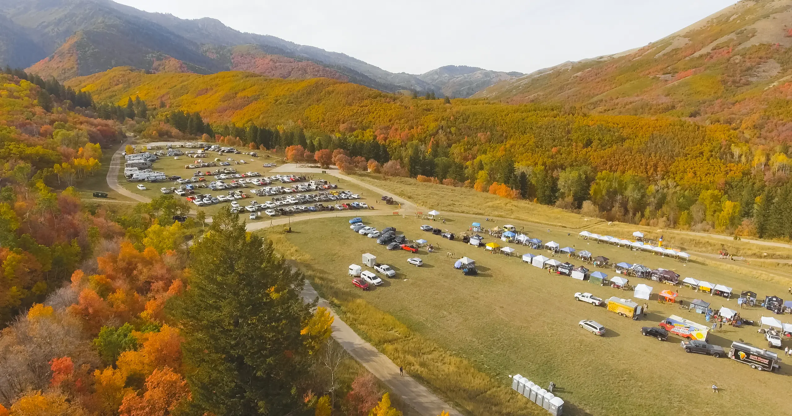 A bird's eye view of North Fork Park with tents, rvs and cars camping for the weekend.